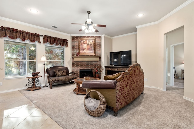 living room featuring ceiling fan, ornamental molding, a brick fireplace, and light tile patterned floors