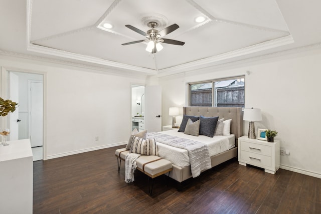 bedroom featuring ceiling fan, a tray ceiling, and ornamental molding