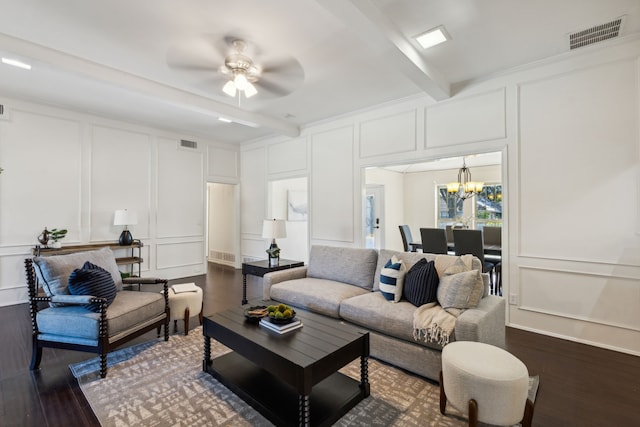 living room with beamed ceiling, ceiling fan with notable chandelier, and dark hardwood / wood-style floors