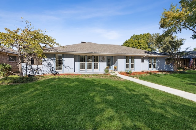 single story home with a front yard