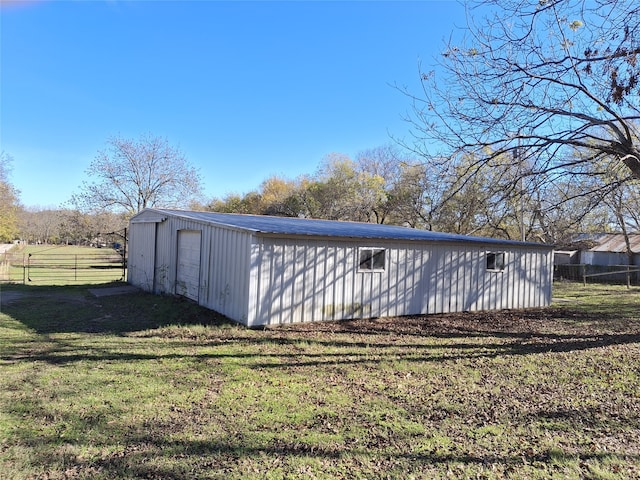 view of outdoor structure with a lawn