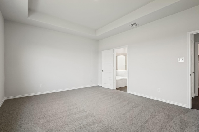 2412 Dahlia Dr, Fort Worth, TX 76123 - unfurnished bedroom with dark carpet, baseboards, and a raised ceiling