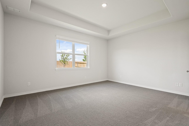 2412 Dahlia Dr, Fort Worth, TX 76123 - unfurnished room with a raised ceiling, dark colored carpet, baseboards, and recessed lighting