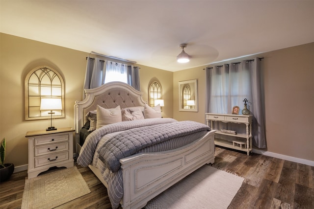 bedroom with ceiling fan and dark wood-type flooring