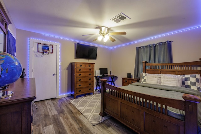 bedroom featuring ceiling fan and hardwood / wood-style flooring