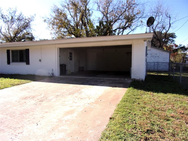 view of front of property with a front yard and a carport