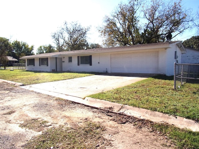 ranch-style house with a garage and a front lawn