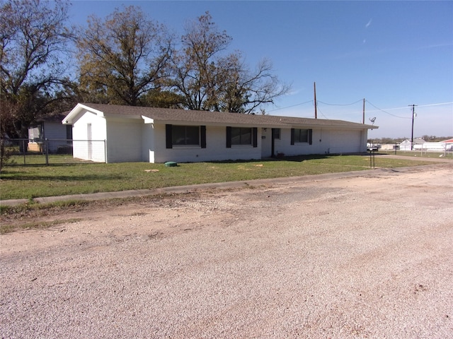 ranch-style house with a front yard