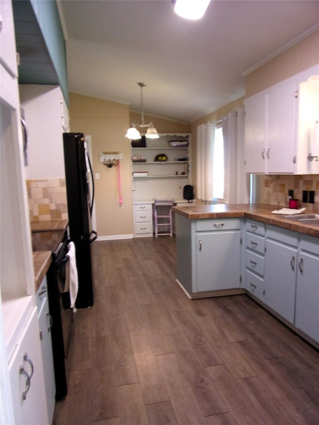 kitchen featuring white cabinets, pendant lighting, vaulted ceiling, and black appliances