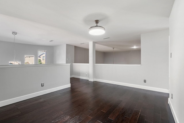 spare room featuring dark hardwood / wood-style flooring