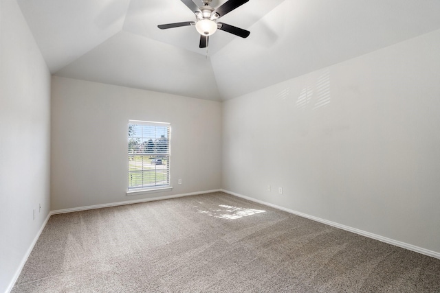 carpeted spare room with vaulted ceiling and ceiling fan