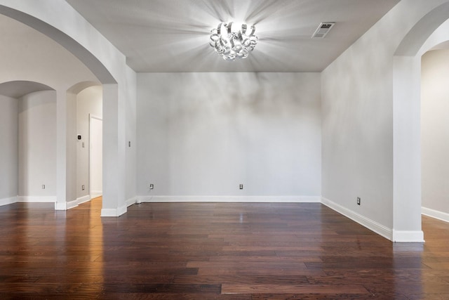 spare room featuring dark hardwood / wood-style floors