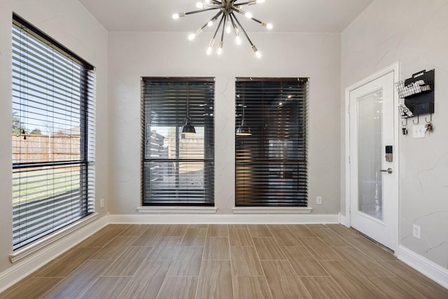 spare room with a chandelier