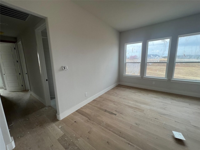 spare room with light wood-type flooring