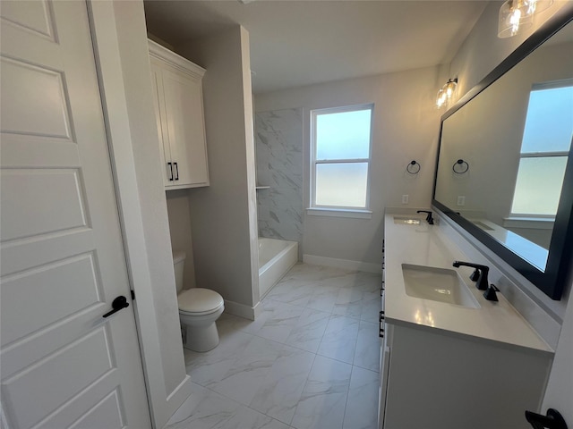 bathroom with marble finish floor, a sink, toilet, and baseboards