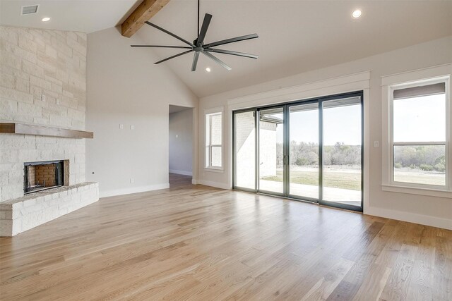 kitchen featuring a large island, white cabinetry, light wood-type flooring, and custom range hood