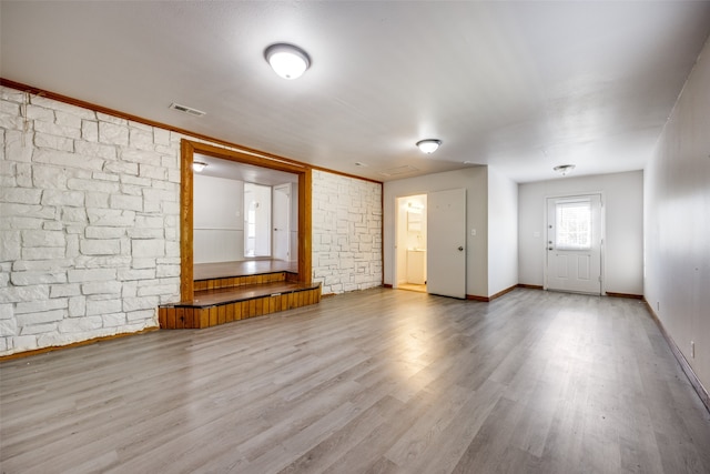 unfurnished living room with wood-type flooring