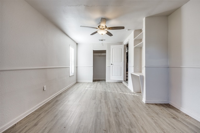 unfurnished room featuring light hardwood / wood-style flooring and ceiling fan