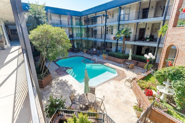 view of pool featuring a patio