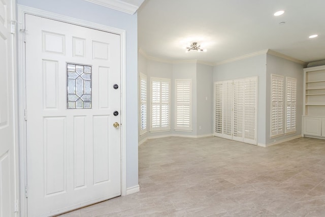 entrance foyer featuring ornamental molding