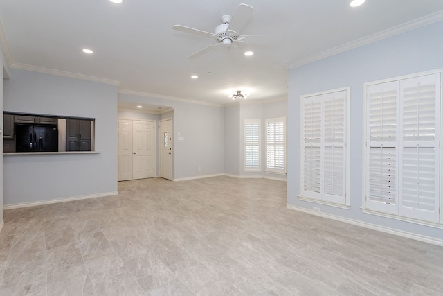 spare room featuring ceiling fan and ornamental molding