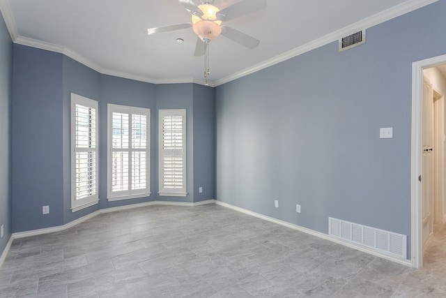 spare room with ceiling fan and ornamental molding