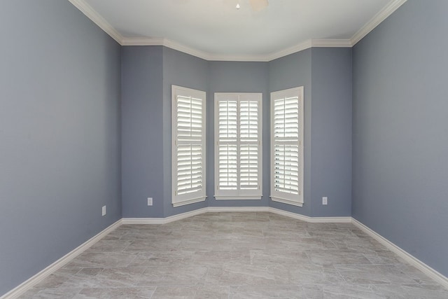 spare room with ornamental molding and a healthy amount of sunlight