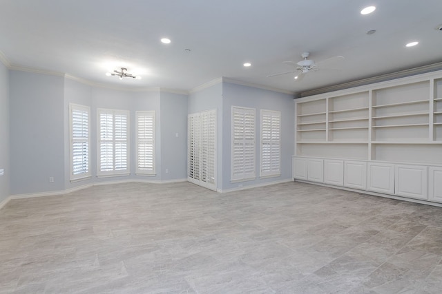 unfurnished room featuring ceiling fan and crown molding