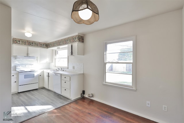 kitchen featuring white cabinets, white appliances, plenty of natural light, and exhaust hood