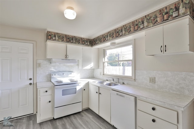 kitchen featuring sink, tasteful backsplash, white appliances, white cabinets, and light wood-type flooring