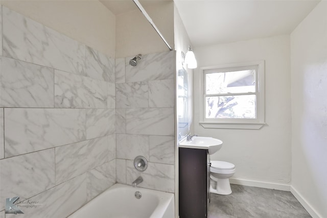 full bathroom with tiled shower / bath combo, toilet, and vanity