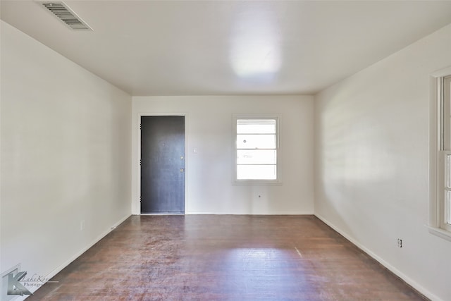 spare room with dark hardwood / wood-style floors