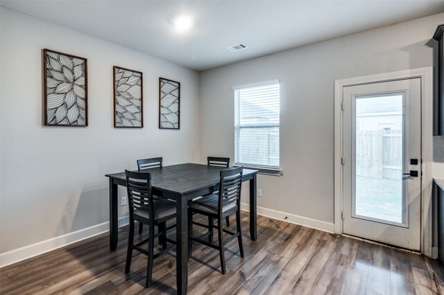 dining area featuring dark hardwood / wood-style floors