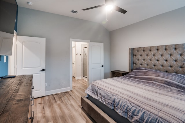 bedroom featuring ceiling fan, light hardwood / wood-style flooring, and high vaulted ceiling