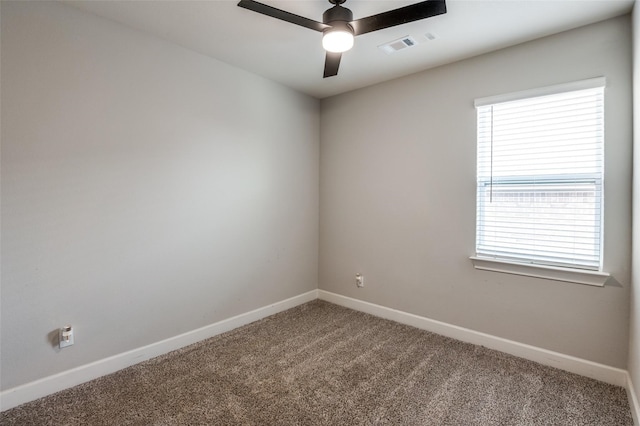 empty room with carpet flooring and ceiling fan