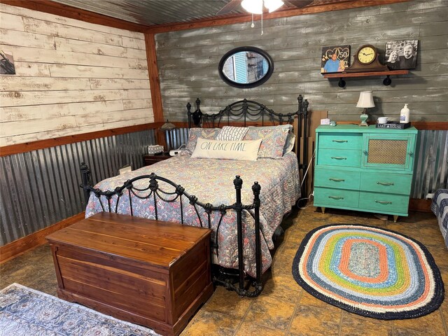 bedroom with wood walls