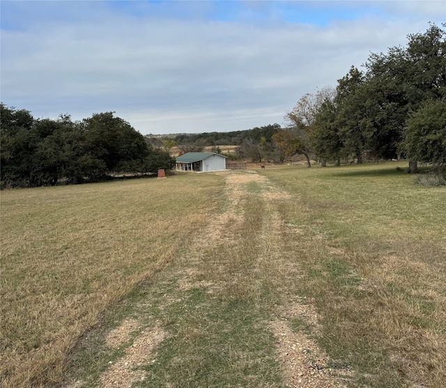 view of yard with a rural view