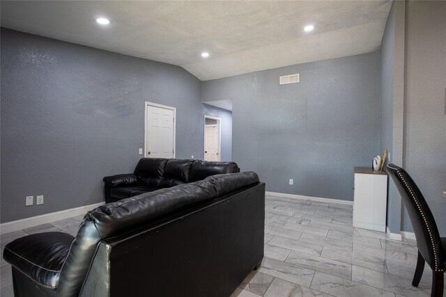 living room with lofted ceiling