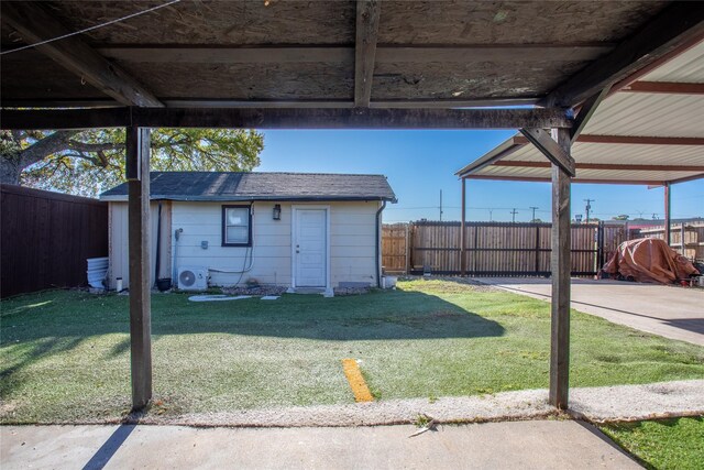 view of yard with an outbuilding and ac unit