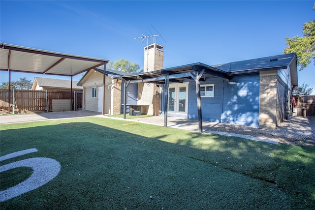 rear view of house with a lawn