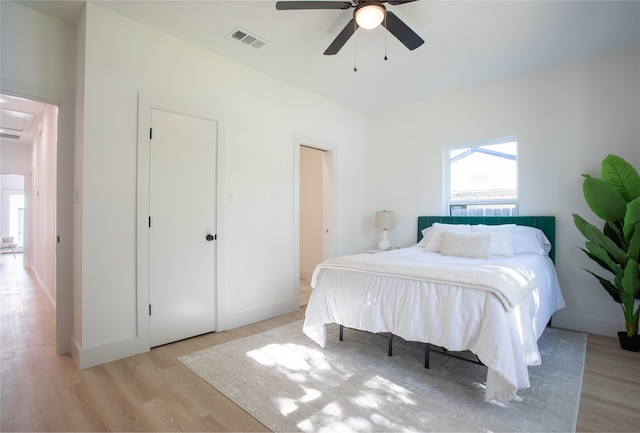 bedroom featuring ceiling fan and light hardwood / wood-style flooring