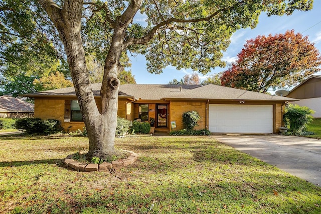 ranch-style home featuring a front yard and a garage