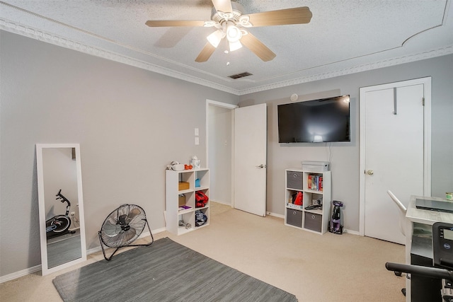 interior space with ceiling fan, light colored carpet, and a textured ceiling