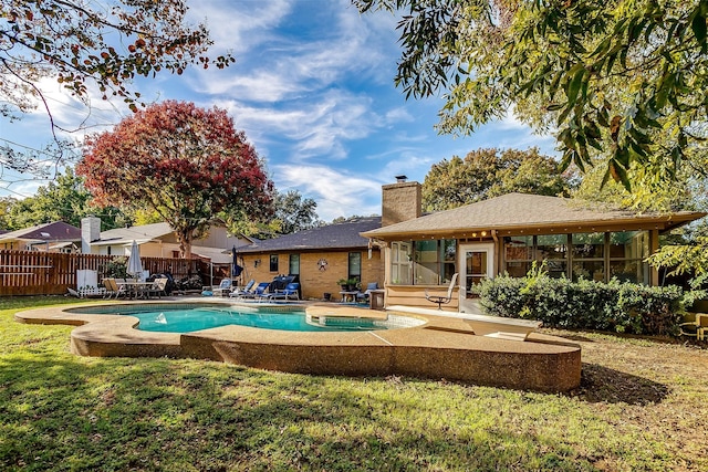 view of pool with a lawn and a patio area