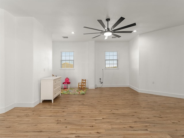 game room featuring ceiling fan and light wood-type flooring