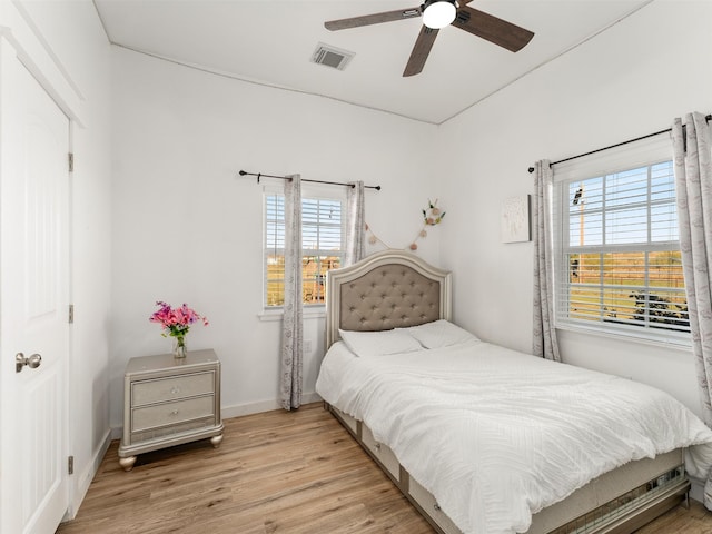 bedroom featuring light wood-type flooring and ceiling fan