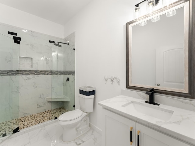 bathroom featuring vanity, toilet, and an enclosed shower