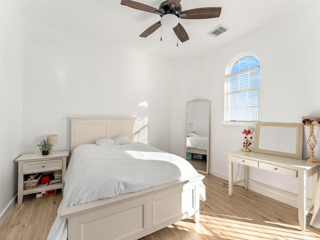 bedroom with ceiling fan and light hardwood / wood-style floors