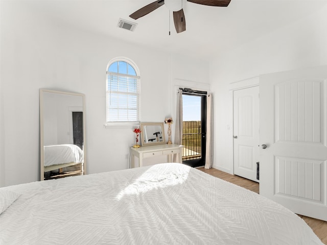 bedroom with access to outside, ceiling fan, and light hardwood / wood-style floors