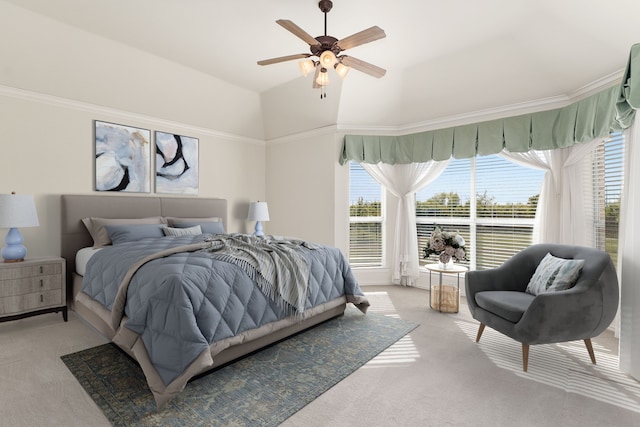 bedroom with ceiling fan, light carpet, and ornamental molding